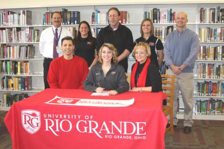 Gallia Academy's Mattie Lanham (seated at center) signed to play softball at Rio Grande during a ceremony last Friday.